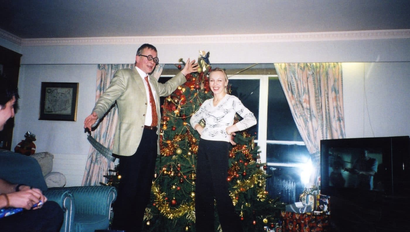 Mady beside a Christmas tree