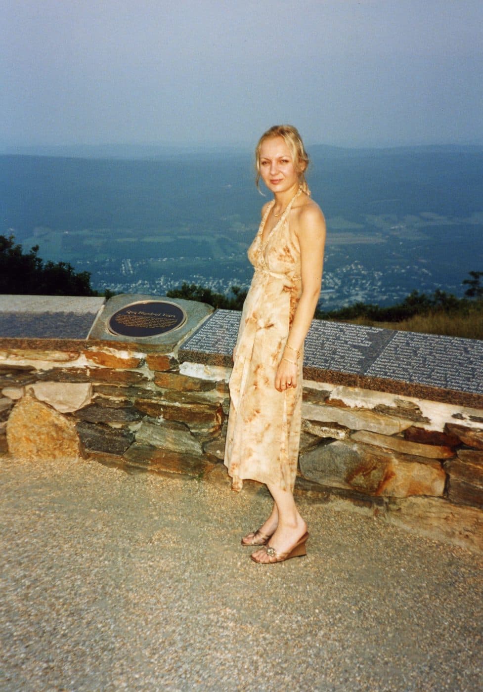 Mady on a hillside overlooking a valley